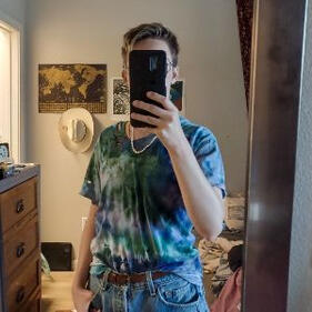 Mirror selfie of Faun, the phone covers their face